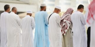 Preventing others from crossing during the prayer
