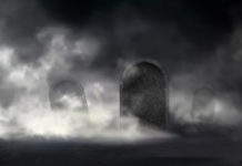 Writing the name of the deceased person on a gravestone