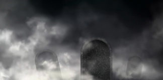 Writing the name of the deceased person on a gravestone
